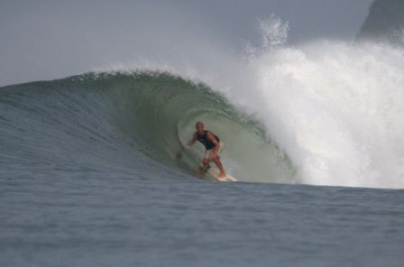 Surfer deep in the barrel at Las Flores