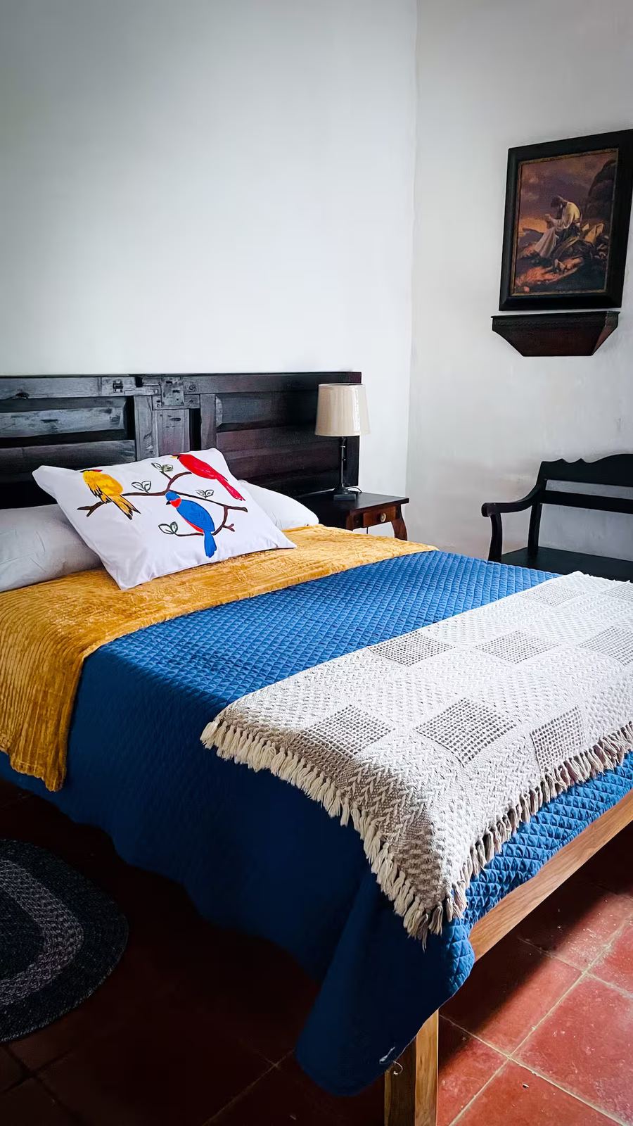 Cabin bedroom at Monte Berat with wooden headboard