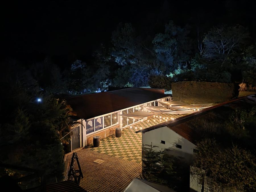 Monte Berat's event hall lit up at night