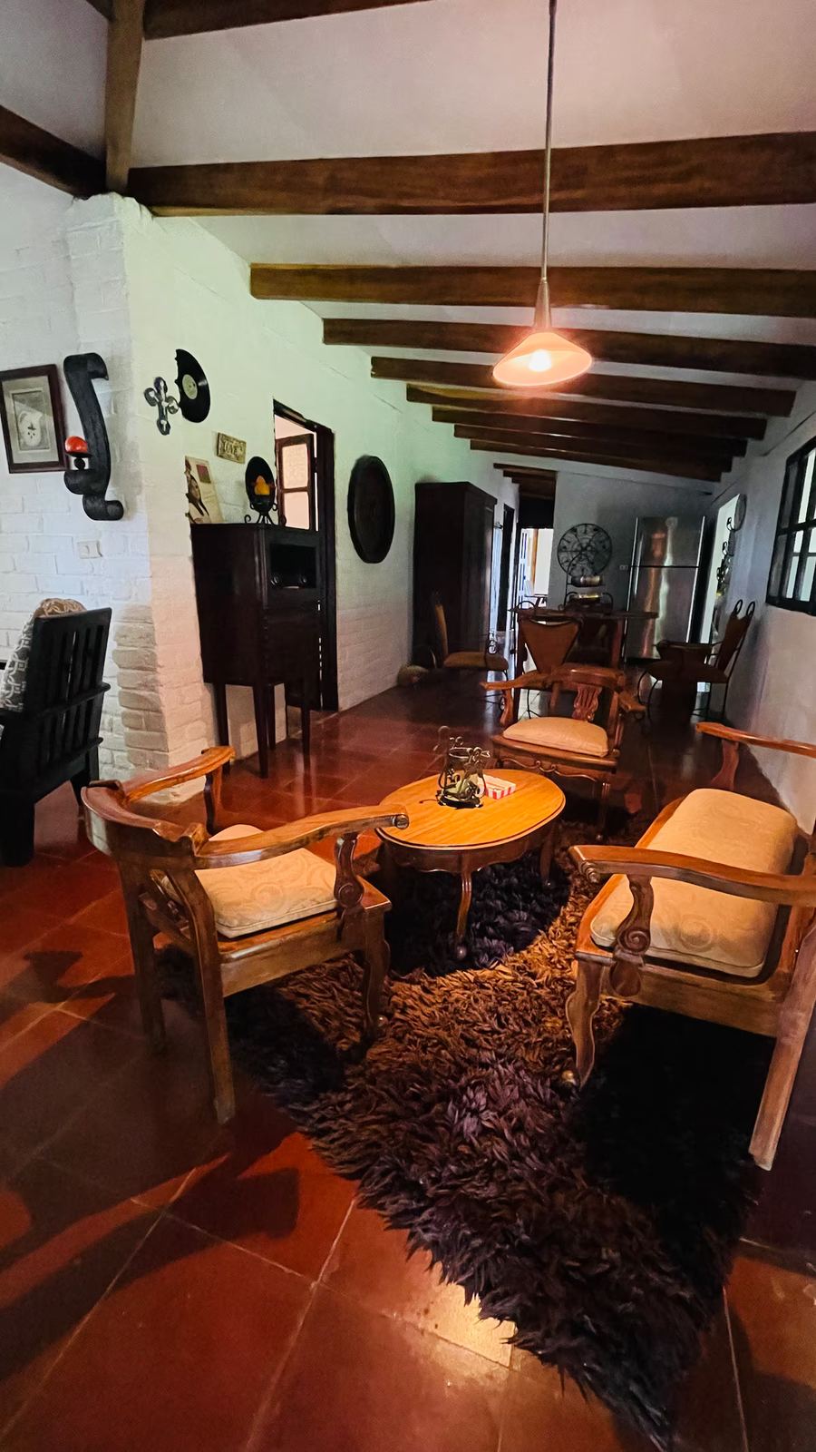 Cabin living room with exposed beams at Monte Berat