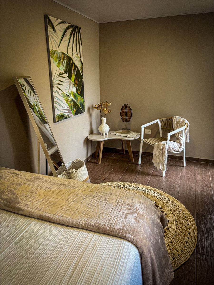Umbra cabin bedroom with botanical art at Monte Berat