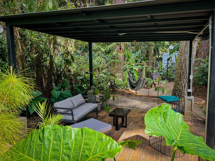 Jungle terrace lounge with hammock chair at the Umbra cabin