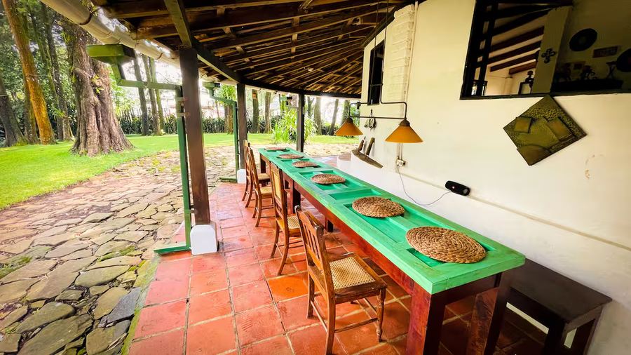 Long dining table on the veranda at Monte Berat
